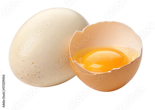 Fresh chicken eggs with cracked shell and rich yellow yolk isolated on white background