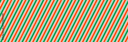 Red and green Christmas seamless pattern. Xmas diagonal stripes wallpaper. Candy cane peppermint repeating background. Winter holiday present wrapping paper design. Vector line decoration backdrop
