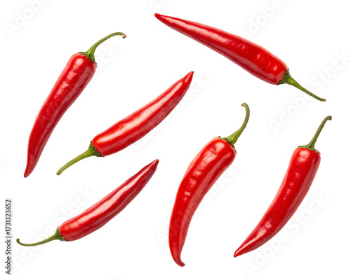 Several ripe red chili peppers scattered and arranged artistically on a dark background isolated on white background isolated on transparent background