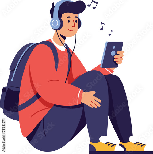 A young student relaxing with headphones on, listening to a streaming music playlist or podcast on his tablet