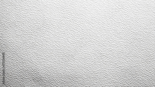 A simple white background showing the fine grain and bumpy texture of a synthetic material with subtle light and shadow