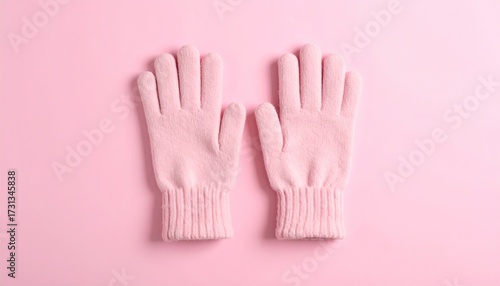 Soft Pink Gloves on a Matching Background Offer a Touch of Warmth and Comfort in Winter's Embrace
