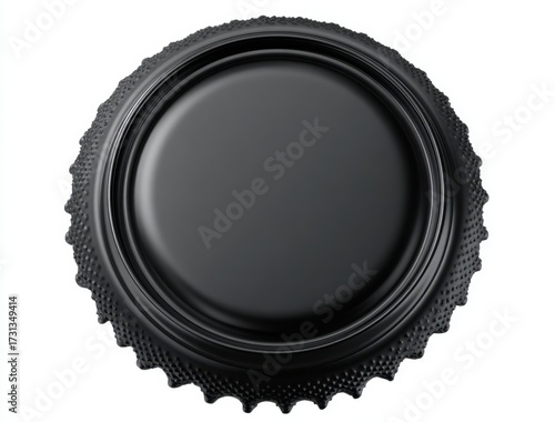 Close-up of a black camera lens cap with textured edge and smooth center