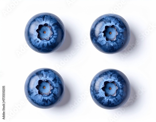 Four Fresh Blueberries on White Background, Close-Up View.