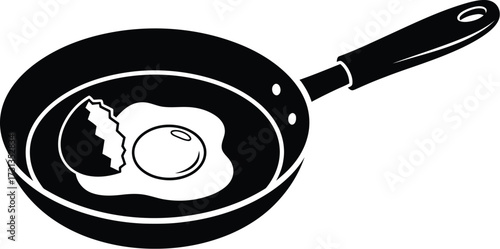 Black frying pan with a fried egg and broken shell, cooking concept