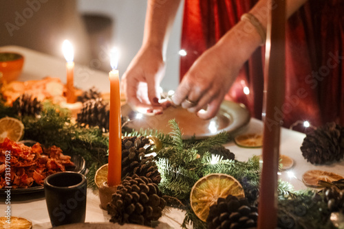 Close-Up of Hands Serving Food on a Festive Christmas Decorated Table