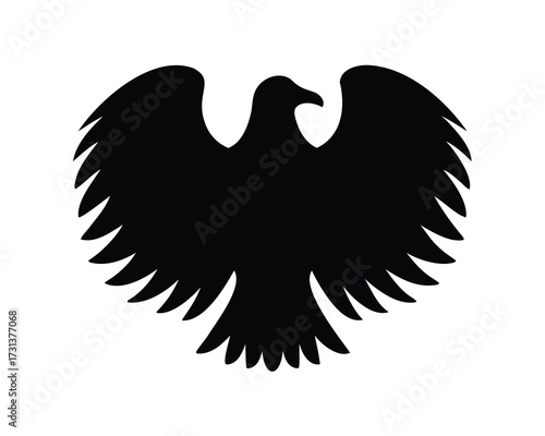 Black silhouette of an eagle with outstretched wings on white background