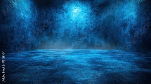 Blue-lit abstract scene of a stage, floor and backdrop with hazy effect