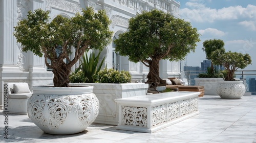 Luxurious outdoor terrace with ornate white stone planters large trees lush greenery elegant benches decorative architecture modern city skyline in background