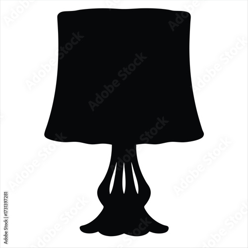 A Silhouette of an Elegant Lamp with a Wide Shade and Base