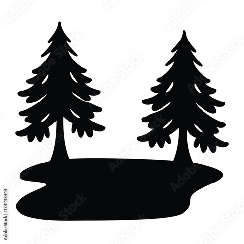 Silhouette of two evergreen trees growing beside a body of water