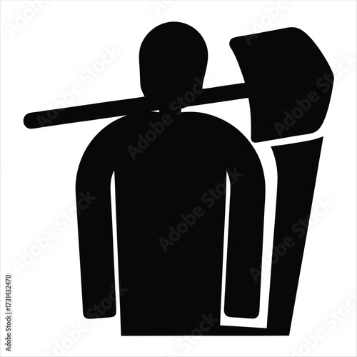 Silhouette image of a worker with a shovel over his shoulder
