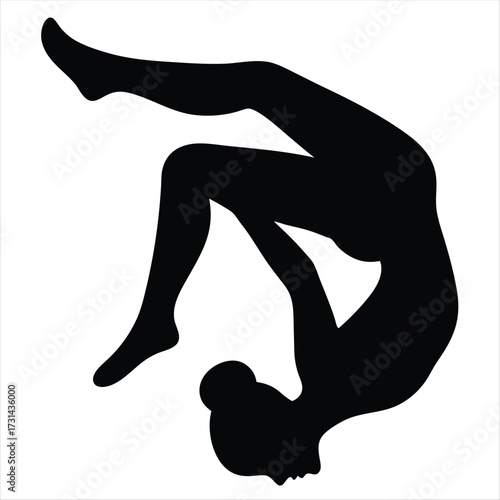 Silhouette of a female gymnast in a backbend acrobatic pose