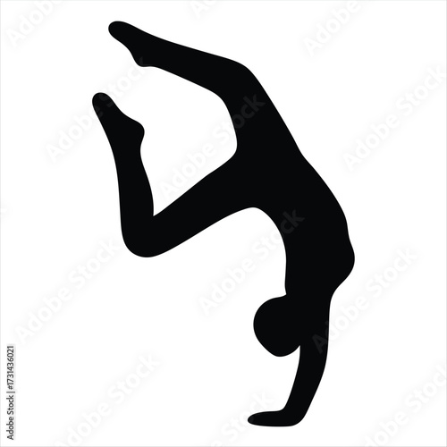 Silhouette of a person performing a gymnastic handstand with legs split