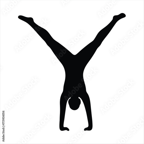 Black silhouette of person doing a handstand with legs spread wide
