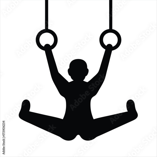 Silhouette of a gymnast performing a straddle split on gymnastic rings