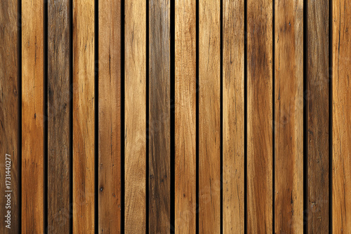 An arrangement of vertical wooden planks forms a textured surface showcasing natural wood grain and warm colors