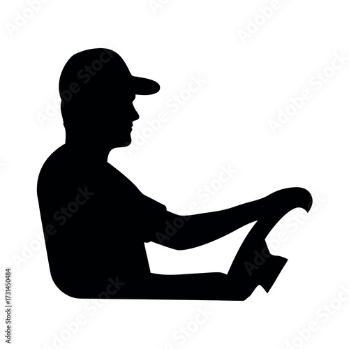 Silhouette of a person wearing a baseball cap driving a car