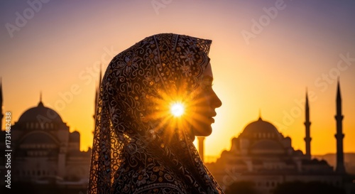 Woman in hijab at sunset with historical mosque silhouette a symbolic blend of faith and cultural