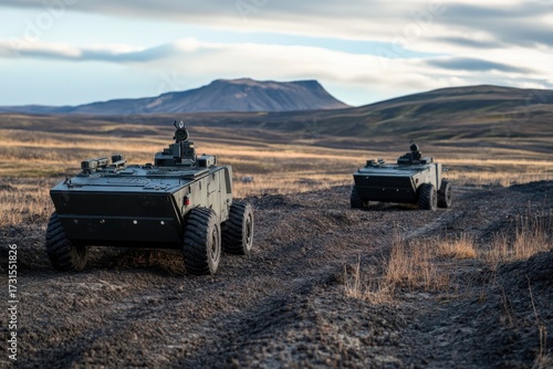 Military robots conducting reconnaissance in a remote, mountainous landscape during sunset