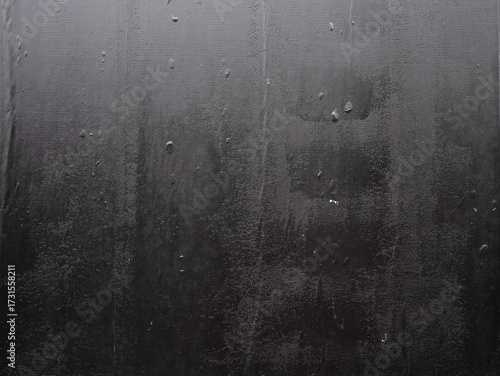 Imperfect black wheatpaste poster texture with air bubbles underneath