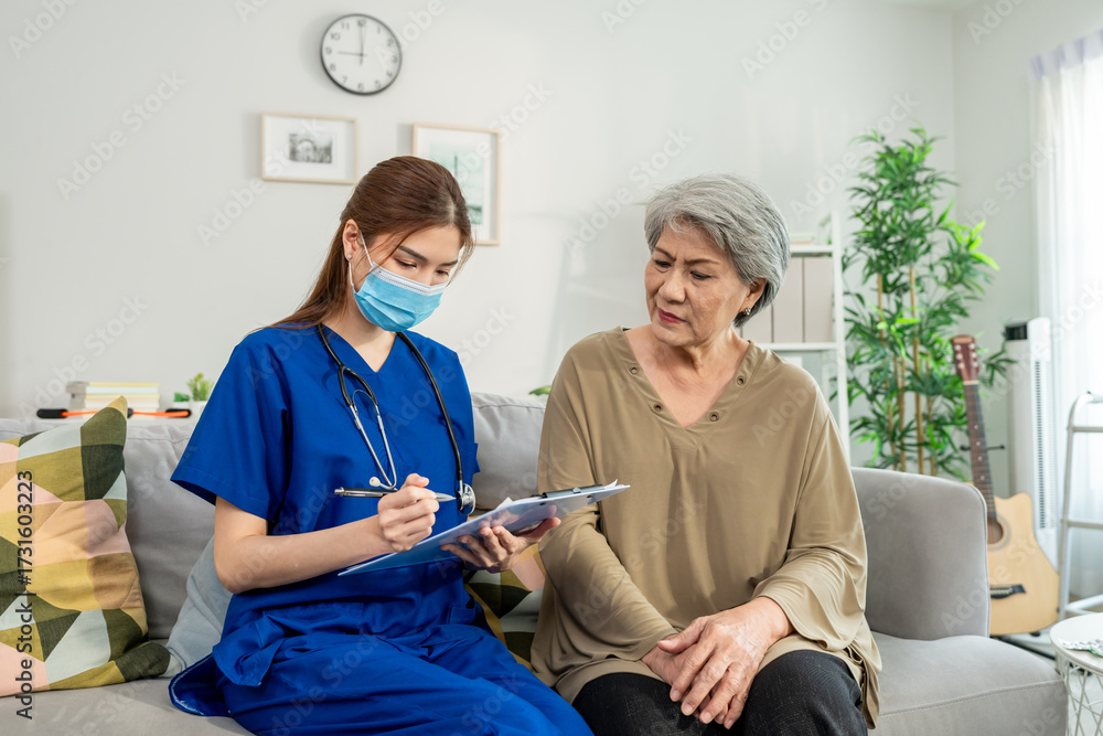 Obraz premium Asian beautiful caregiver examine senior woman patient at nursing home. 