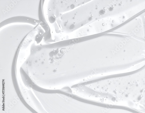 Close-up of translucent gel texture with air bubbles on a light background