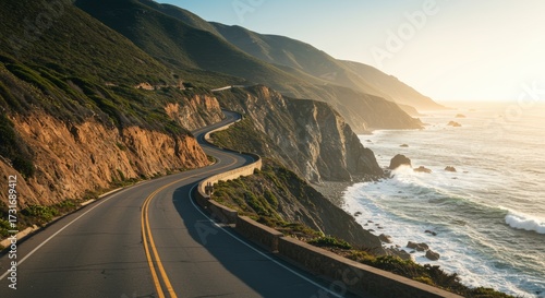 Scenic coastal highway winding alongside ocean cliffs and mountains bathed in warm sunlight travel concept