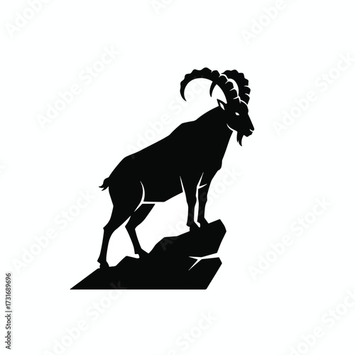 Silhouette of a Majestic Mountain Goat with Curved Horns.