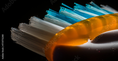 Colorful toothbrush close-up with dark background