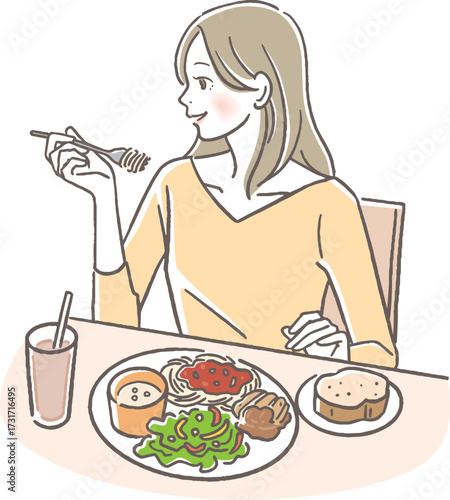 洋食を食べる女性