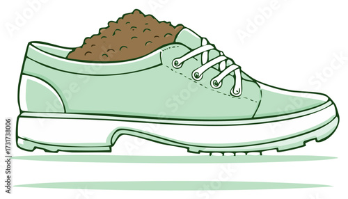 Green sneaker filled with brown soil and dirt inside a shoe