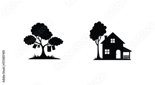Simple black silhouette of a house trees and clothesline with laundry