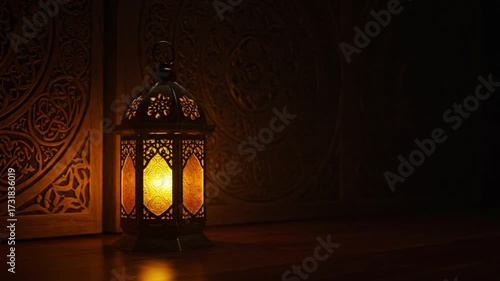 Ramadan lantern glowing in the dark with Islamic patterns.