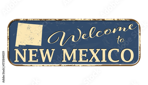 Welcome to New Mexico. A worn blue plaque with the name and outline of the state. Welcome inscription on the road sign