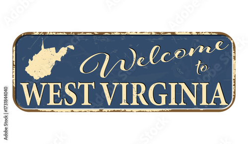 Welcome to West Virginia. A worn blue plaque with the name and outline of the state. Welcome inscription on the road sign