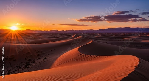 Fototapeta Naklejka Na Ścianę i Meble -  Golden Hour: Mesmerizing Sunrise Over Vast Desert Sand Dunes Landscape