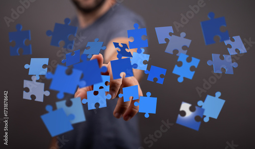 A hand reaching towards blu...