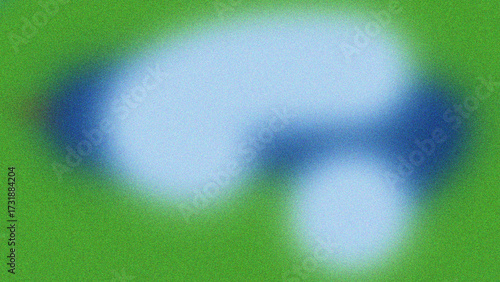 Abstract soft focus blue and white cloud like shapes swirling on a textured green background