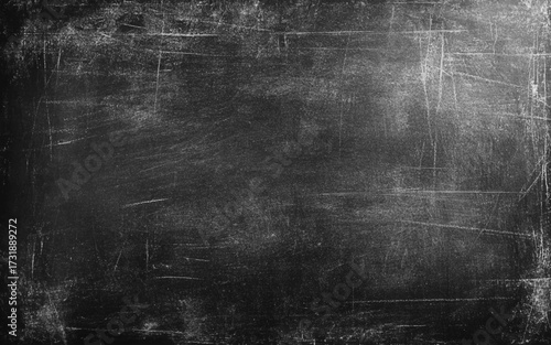 Chalk rubbed out on blackboard background. Black wall grunge background 
