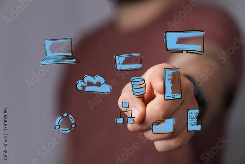 Hand pointing at digital ic...