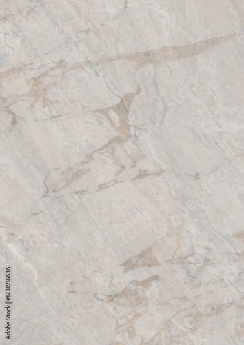 Close-up view of a light-colored marble surface with natural veining patterns