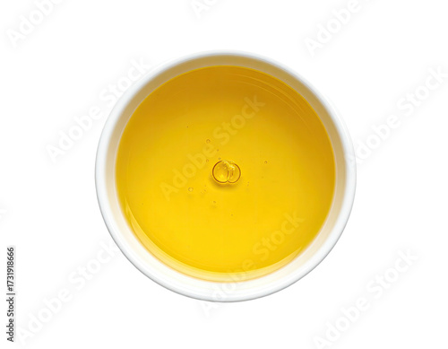 Creamy yellow liquid in small white bowl