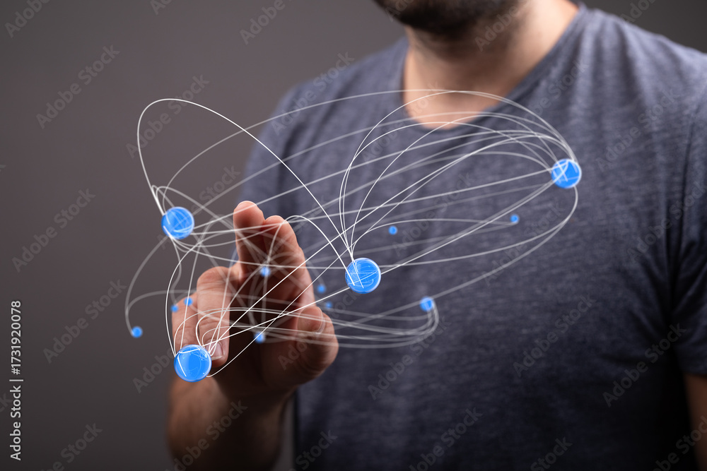 Fototapeta premium Abstract image depicting a man interacting with a digital network, showcasing global connectivity and technology.