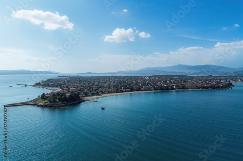 Fototapeta Naklejka Na Ścianę i Meble -  Drone shot capturing coastal islands and beaches in a scenic summer setting with clear blue waters and skies.