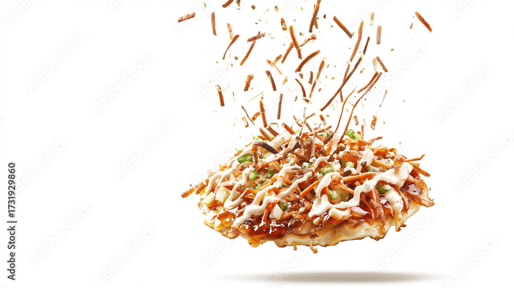 Obraz premium Japanese Pancake Okonomiyaki Floating with Savory Toppings