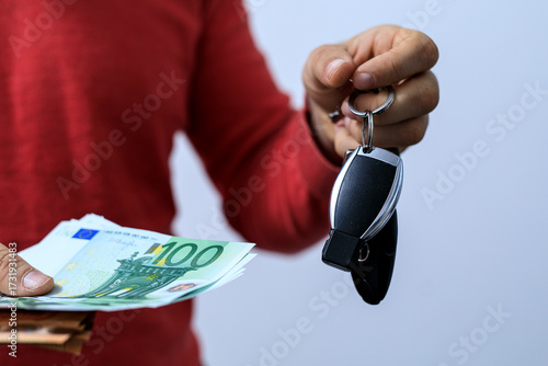 Person holding Euro banknot...
