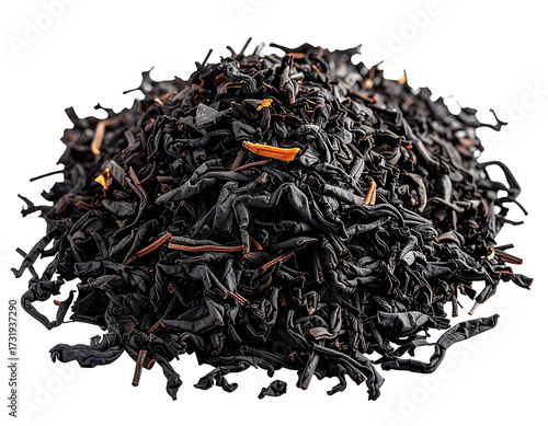 Dark, loose leaf tea pile, with hints of orange