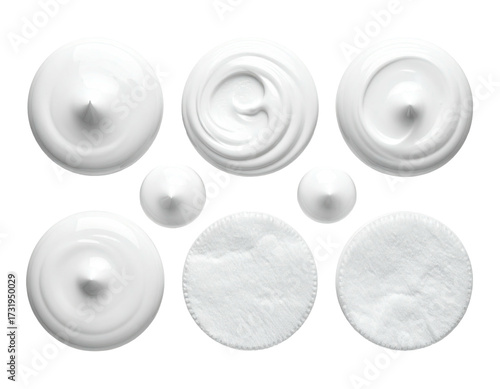 Top-down view of various white cosmetic products.  Circular shapes of cream, lotion, and cotton pads