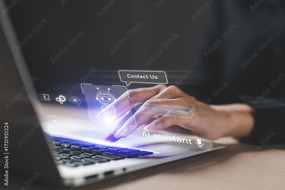 Obraz premium Hand typing on laptop with virtual chatbot and AI assistant interface, representing artificial intelligence technology, digital communication, customer support, and virtual helpdesk services.
